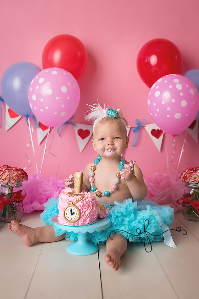 Baby Davina (aka Alice in Wonderland) was serious about her Cake! 🎂 Happy  First Birthday to this sweet girl! I had so much fun putting this -  Natalie Buck Photography - Connecticut