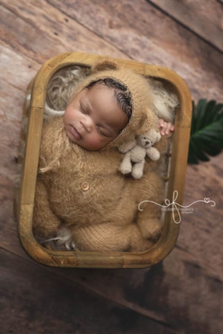 Newborn boy snuggling mini teddy bear in a teddy bear outfit and basket | CT Newborn Photographer Elizabeth Frederick PHotography