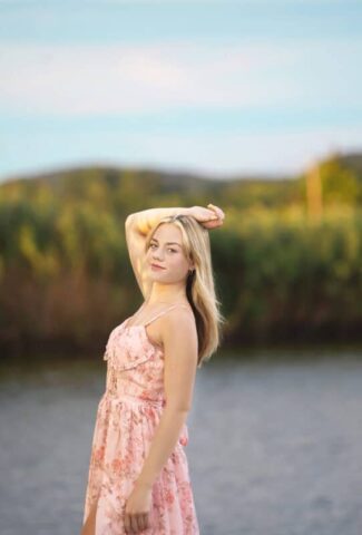 Wallingford CT senior photography session at Gouveia Vineyards, elegant senior portrait in a pink dress with rolling vineyard hills.