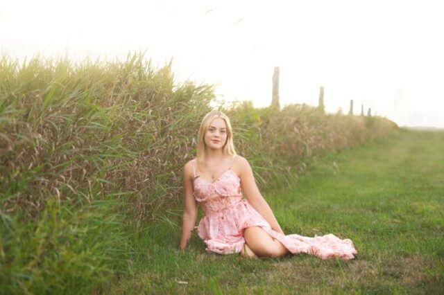 Wallingford CT senior photography session at Gouveia Vineyards, elegant senior portrait in a pink dress with rolling vineyard hills.